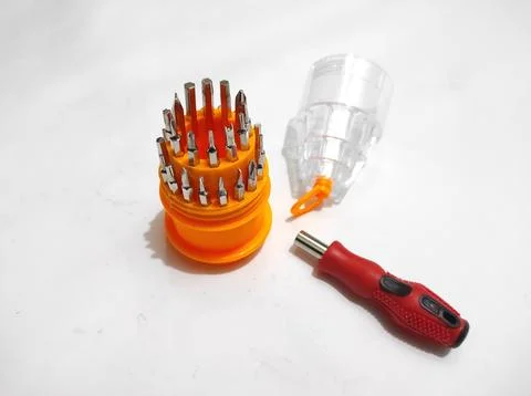 Screwdriver Set with Interchangeable Bits on White Surface Foto stock