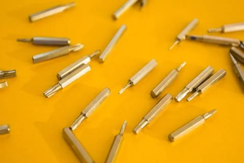 	screwdriver set on a yellow background, concept. Stock Photos