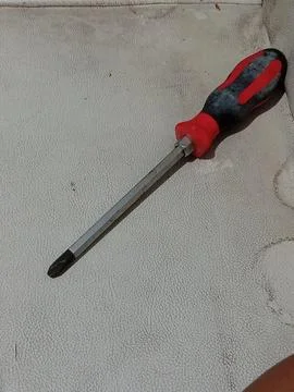 Screwdriver Tool on Textured Surface Foto stock