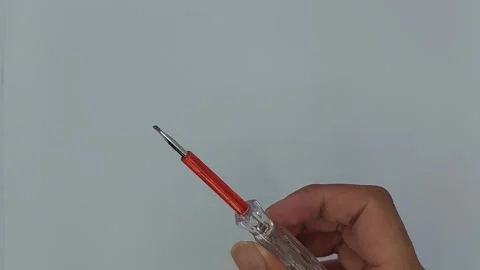 A screwdriver is a tool used to tighten or loosen bolts Stock Footage 245491684