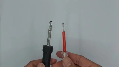 A screwdriver is a tool used to tighten or loosen bolts Stock Footage 245491846