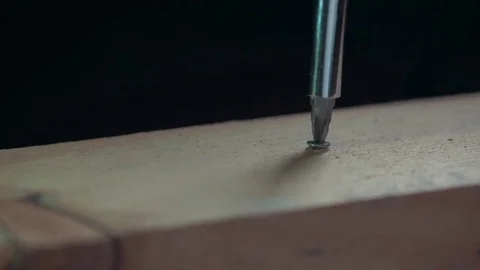 Screwdriver twists the screw Stock Footage 85303112