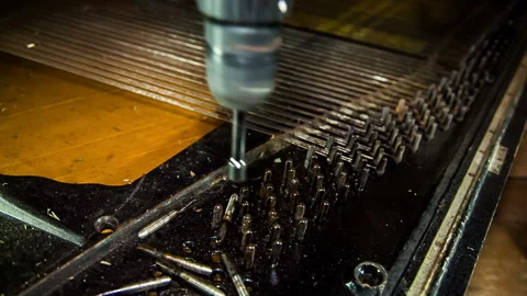 With a screwdriver, unscrew the strings of the piano strings Video stock 85899788