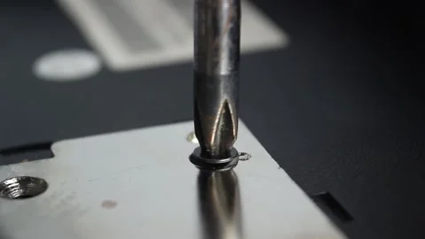 Screwdriver unscrews a screw, closeup Stock Footage 132194855