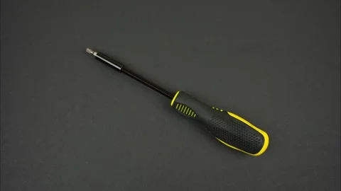 Screwdriver with variety of bits on black background. Stop motion Video stock 281514153