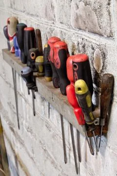 Screwdriver on the wall Stock Photos