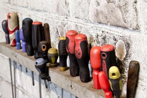 Screwdriver on the wall Stock Photos