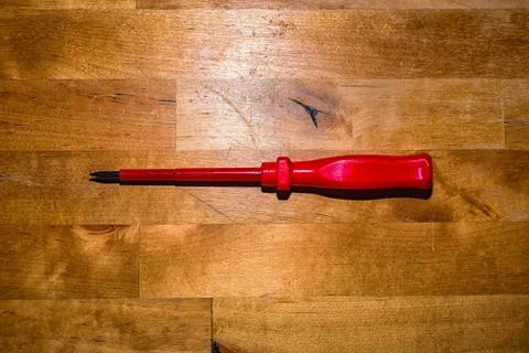 Screwdriver on the working surface Stock Photos