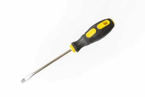 A screwdriver. A working tool. Flat screwdriver on a white background. Repa.. Stock Photos