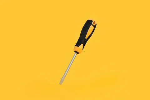 Screwdriver on a yellow background with copy space Stock Illustration