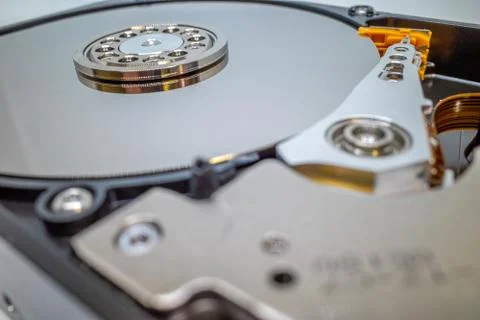A screwed-on hard disk shows the inner workings of a hard disk Stock Photos