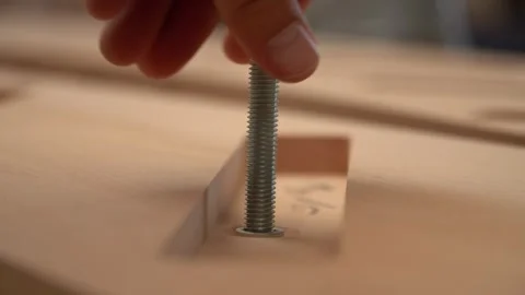 Screwing a Bolt into a Thread in Workshop Vídeos de archivo 293541818