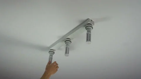 Screwing the bulb Stock Footage 91327195