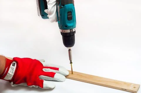 Screwing with electrical screwdriver Stock Photos