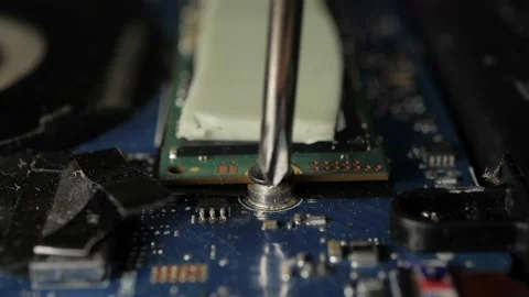 Screwing In M.2 hard drive Computer Macro (1) Stock Footage 237025588