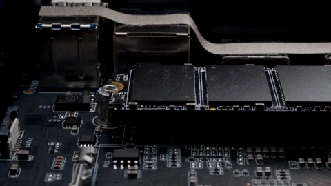 Screwing MSATA nvme M2 with a screwdriver for connecting fast modern SSD Stock Footage 263477688