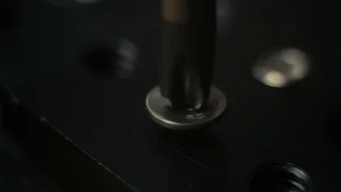 Screwing out the screw from iron panel, closeup 4K Vídeo Stock 86460150