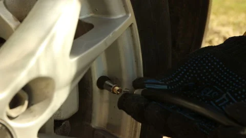 Screwing up pump plug to wheel Stock Footage 130648786