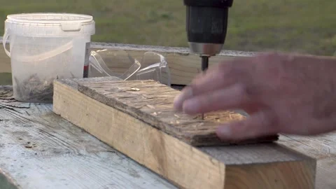 Screwing a screw into a board 4K Stock Footage 294049889