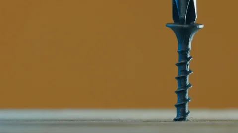 Screwing the screw into the board (screwdriver) Stock Footage 106304169