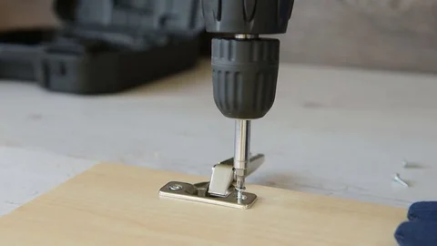 Screwing a screw with electric screwdriver. Stock Footage 83165146