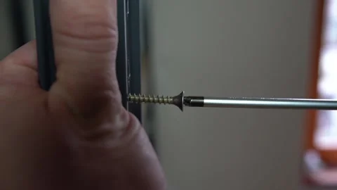 Screwing screw inside the panel Stock Footage 159580806