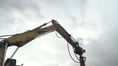 Screwing screw piles into the ground at a construction site in winter Stock Footage 148635342