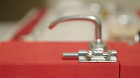Screwing a screw into wood.Installation hinge Video stock 69868122