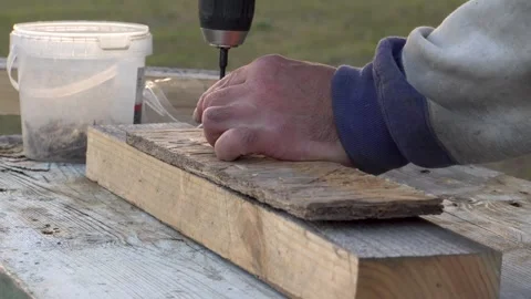 Screwing in a self-tapping screw 4K Stock Footage 294050111