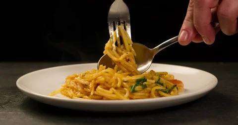 Screwing spaghetti on fork 4k Stock Footage 104060324