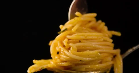 Screwing spaghetti with fork and spoon Closeup 4k Stock Footage 104061601