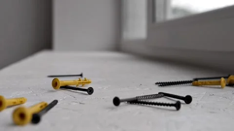 Screws and dowels fly into the frame Stock Footage 202648386