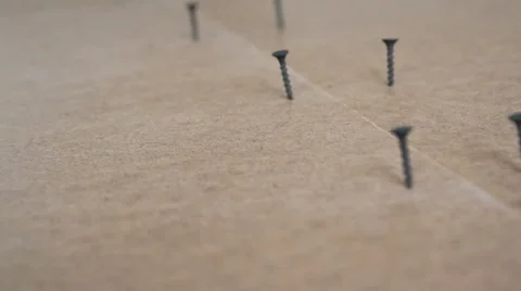 Screws are screwed into the floor Stock Footage 41087419