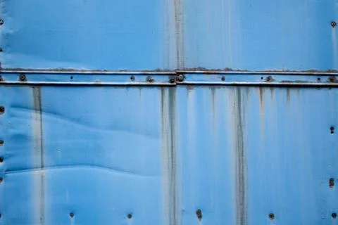 Screws on a blue rusty background Stock Photos
