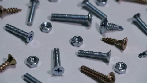 Screws, bolts, nuts, lying in the spread Stock Footage 72396842
