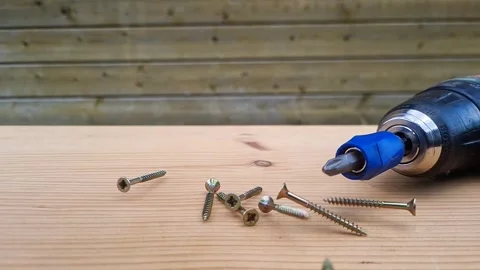 Screws fall down in slow motion Stock Footage 273741552