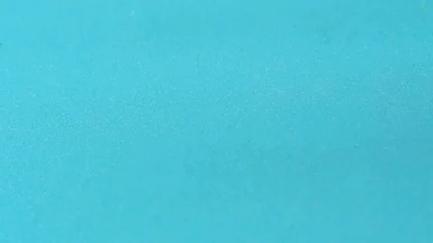 Screws falling in slow motion against a blue background. Stock Footage 127285276