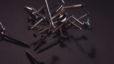 Screws falling in slow motion Stock Footage 274271239