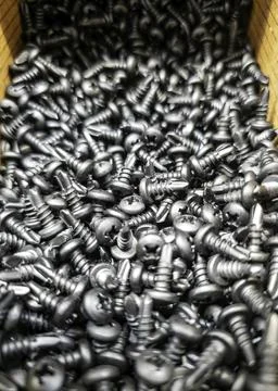 Screws in hardware stores of different sizes, construction and architecture Stock Photos