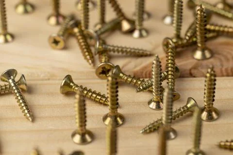 Screws for installation and construction work with wood, yellow metal self ta Stock Photos