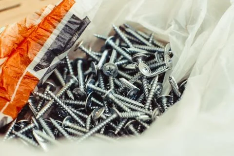The screws lie in a pile Stock Photos