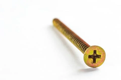 Screws located on a white background Stock Photos