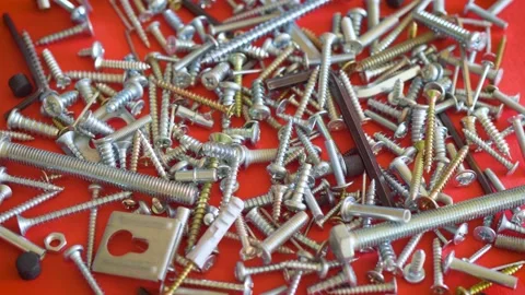Screws nails and tools on a red background Video stock 139277786