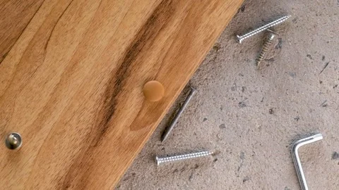 Screws, nails falling on concrete wood texture background. Closeup of screw.. Stock Footage 274469242