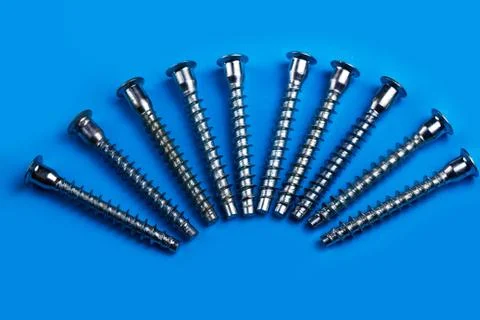 Screws on a plain background. copy space one Stock Photos