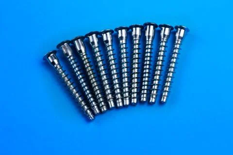Screws on a plain background. copy space one Stock Photos
