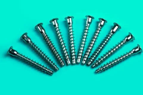 Screws on a plain background. copy space one Stock Photos