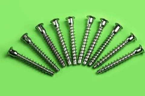 Screws on a plain background. copy space one Stock Photos