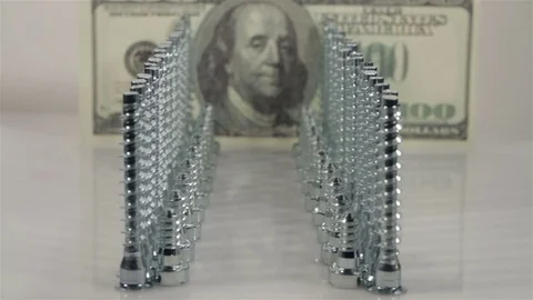 Screws standing and dollars . Closeup. Dolly slider shot Stock Footage 72157862