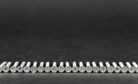 Screws in straight line Stock Photos